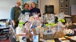 volunteers with pre-auction baskets for newton Free Library Spring Fling fundraiser